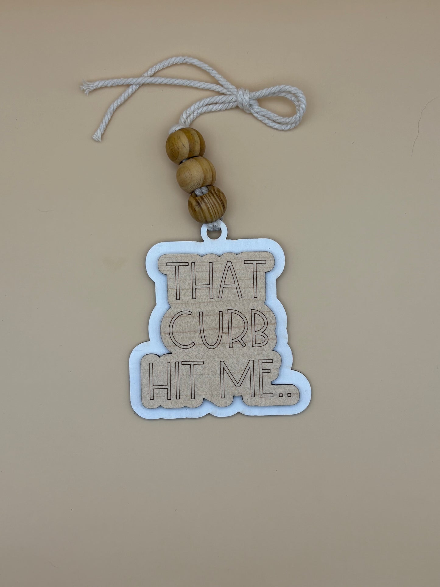 That Curb Hit Me Car Charm