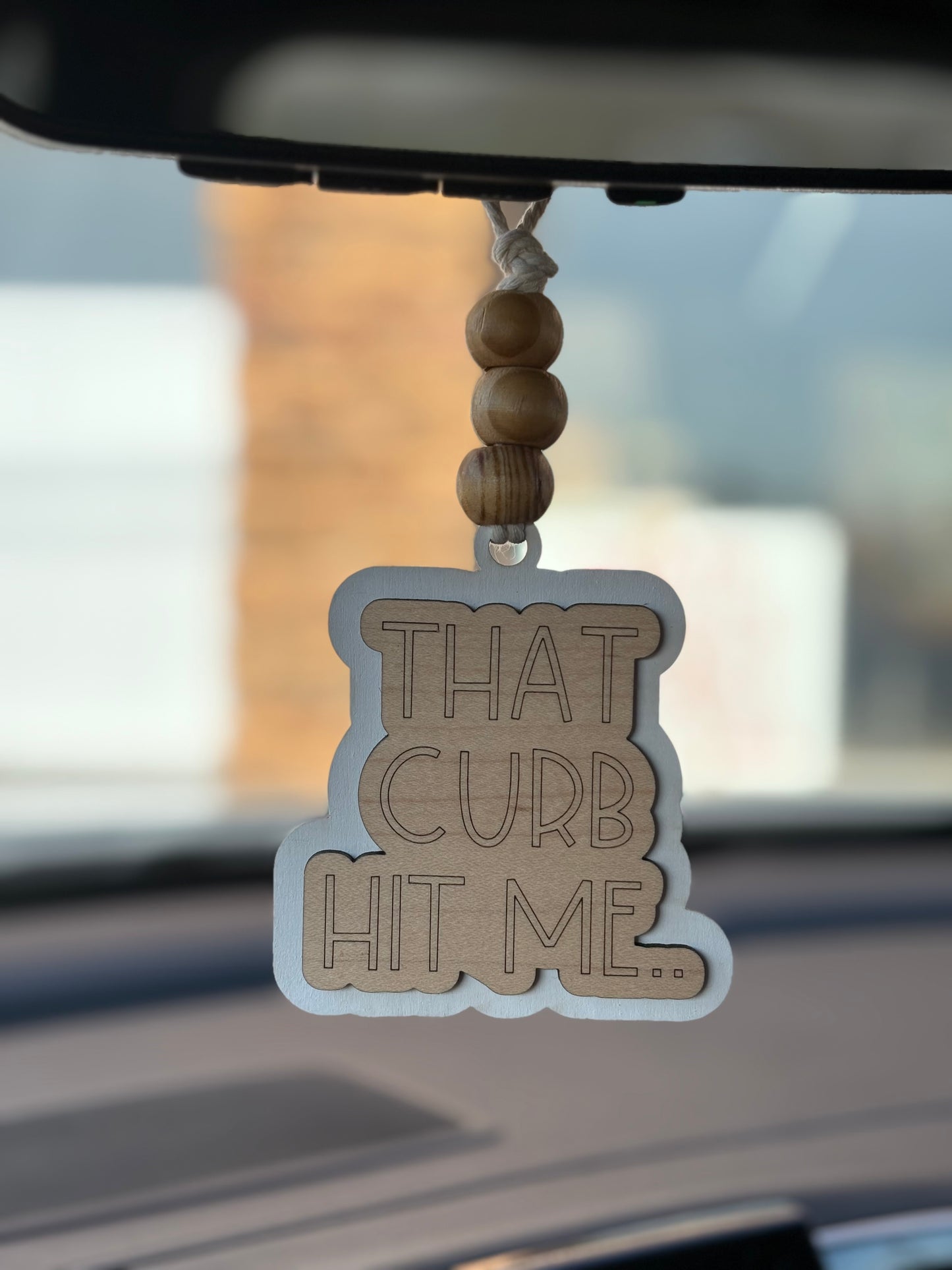 That Curb Hit Me Car Charm