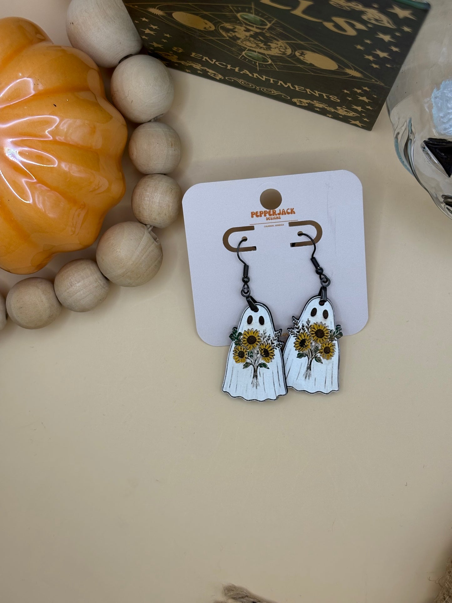 Ghost carrying flowers earrings