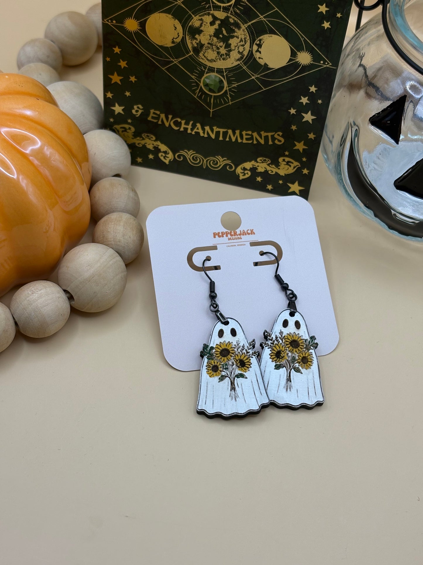 Ghost carrying flowers earrings