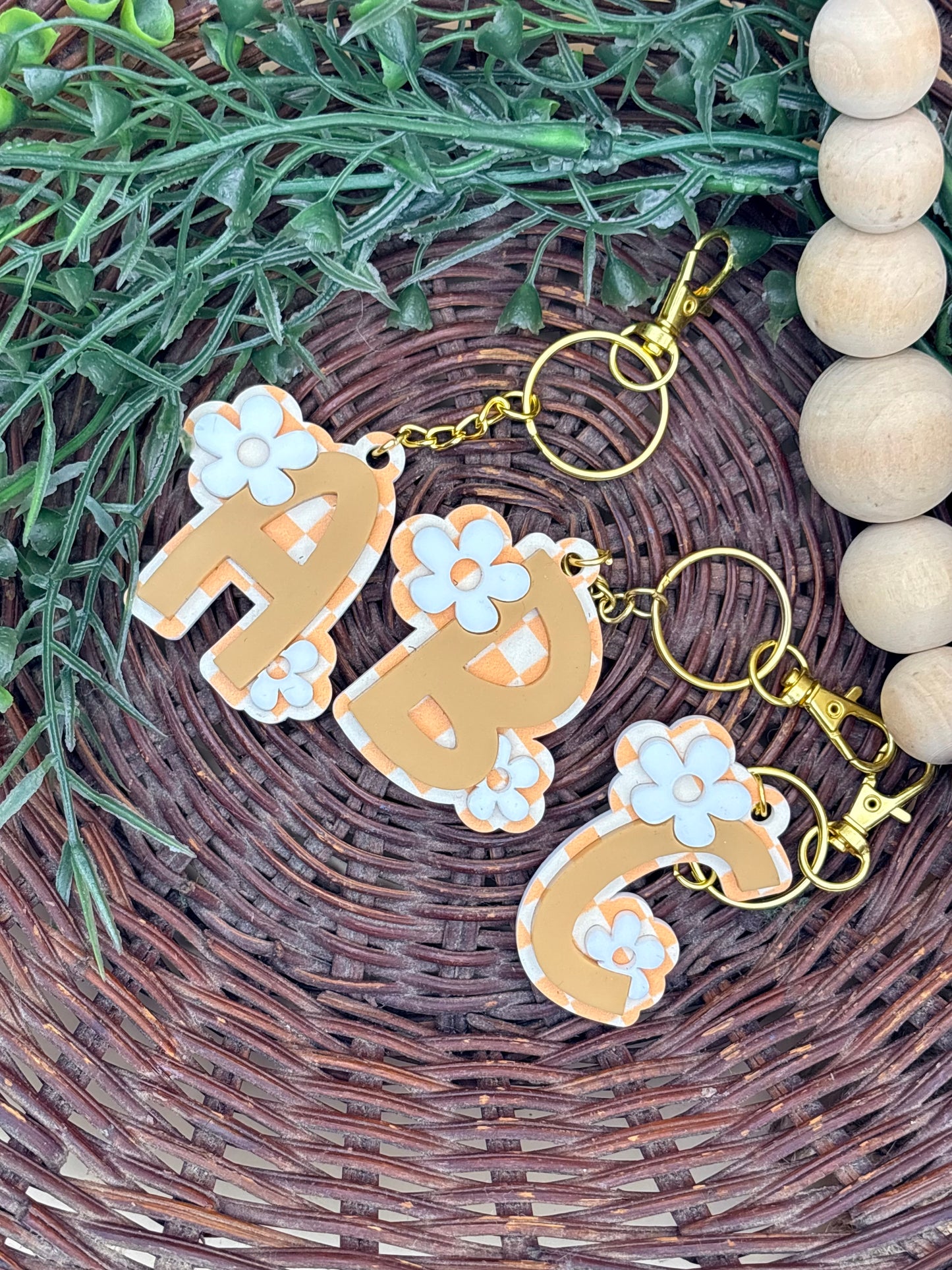 Retro Groovy Checkered And Floral Initial Keychains