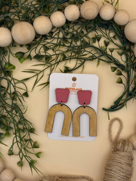 Arch with pink stud earrings