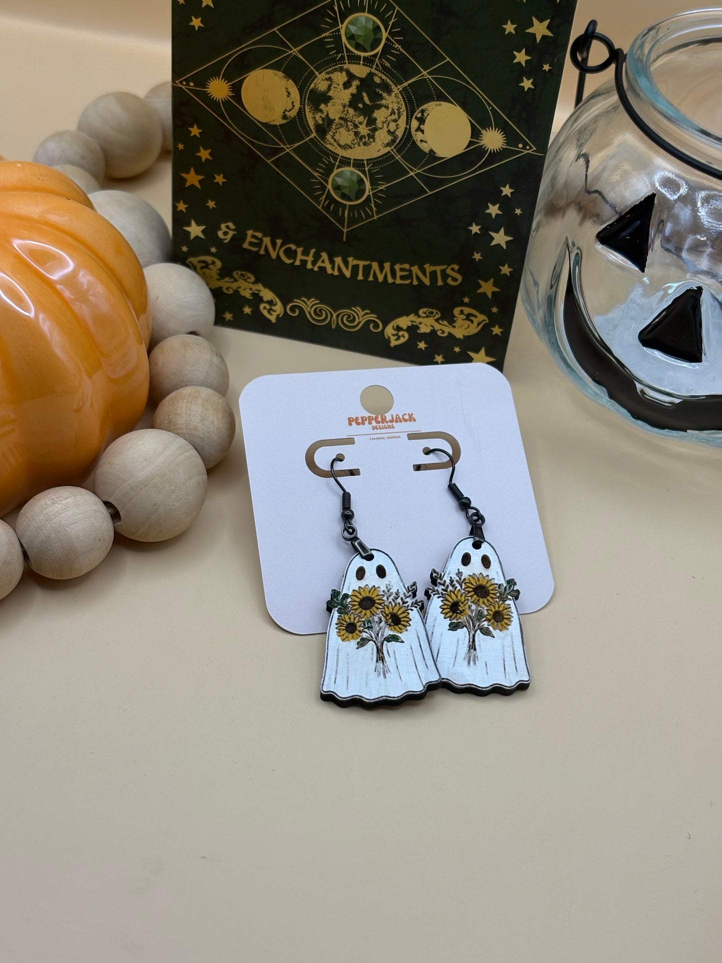 Ghost carrying flowers earrings